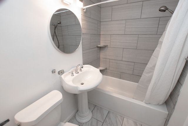 bathroom with toilet and shower / tub combo with curtain