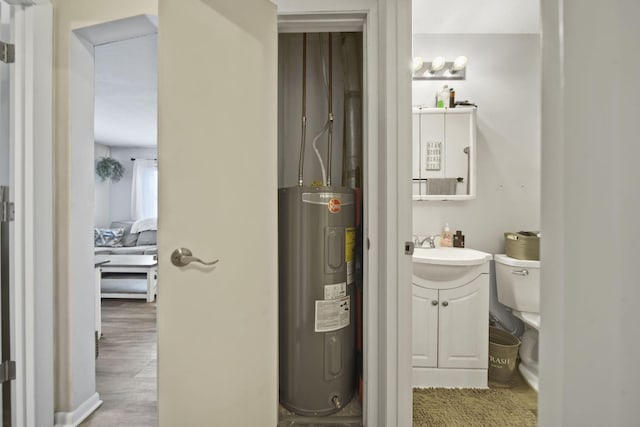 utility room featuring sink and water heater