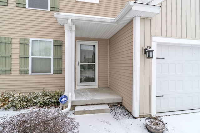 view of snow covered property entrance