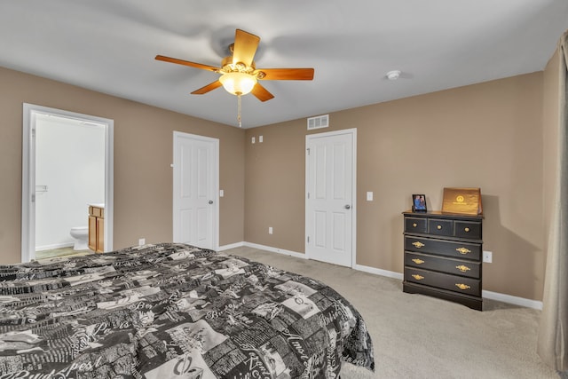 carpeted bedroom with connected bathroom and ceiling fan