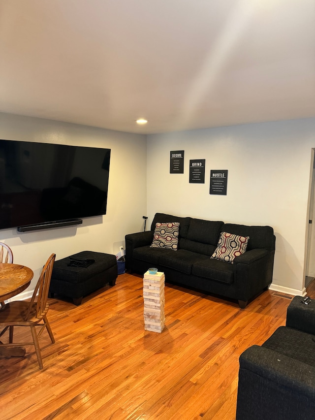 living room with light hardwood / wood-style floors