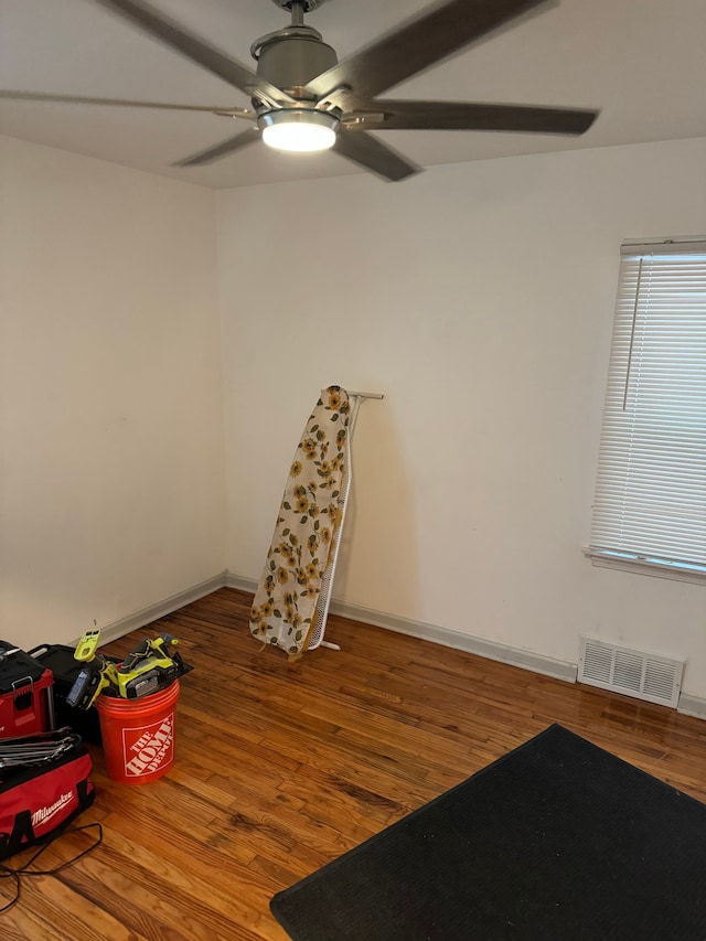 interior space with ceiling fan and hardwood / wood-style flooring