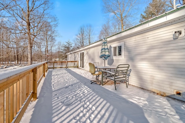 view of snow covered deck