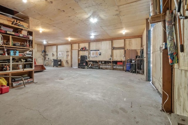 interior space with a workshop area and concrete floors