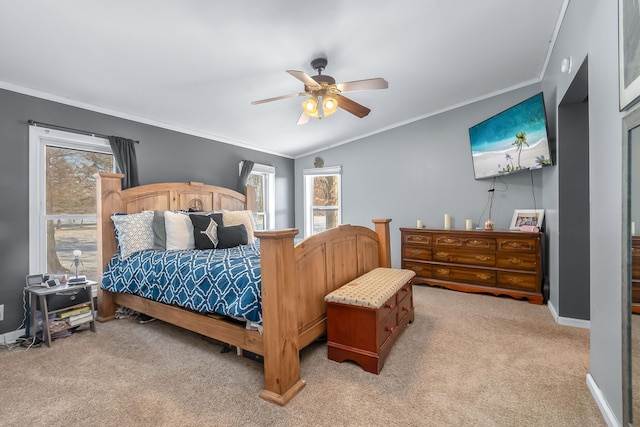 bedroom with ceiling fan, light colored carpet, ornamental molding, and vaulted ceiling