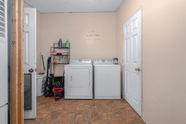 clothes washing area featuring washer and clothes dryer