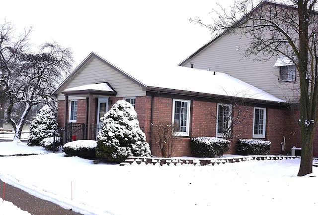 view of front of home featuring cooling unit