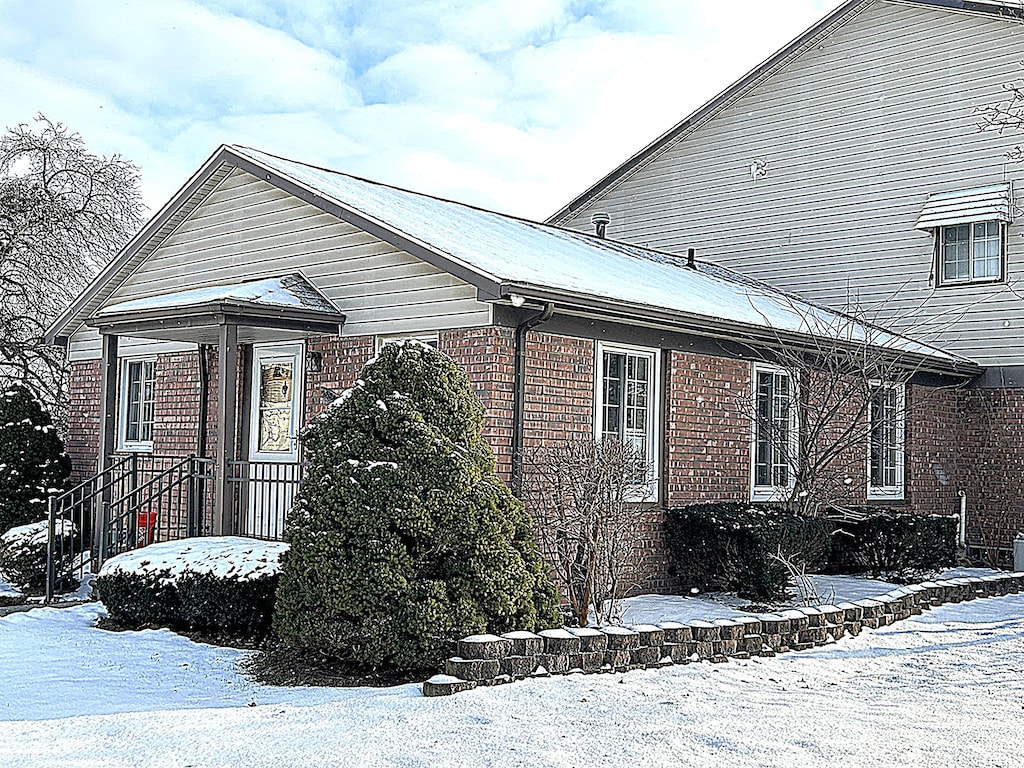 view of snow covered property