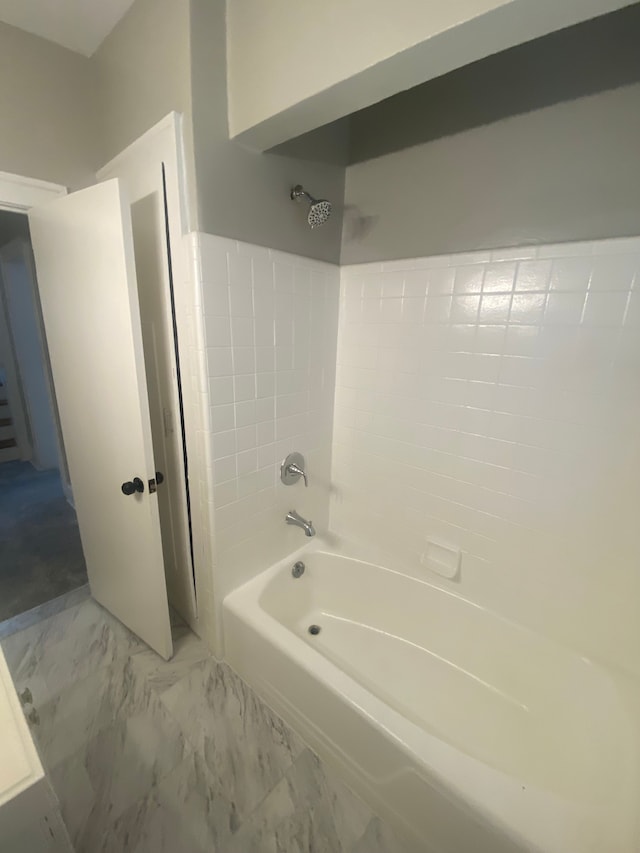 bathroom with shower / bathtub combination