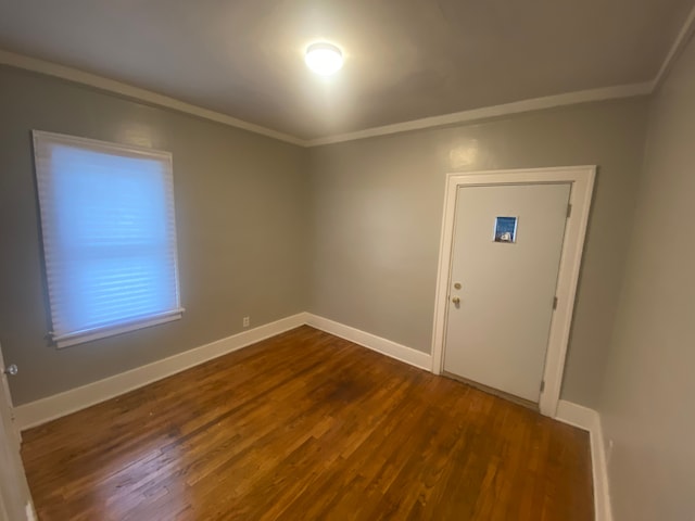 foyer with crown molding and hardwood / wood-style flooring