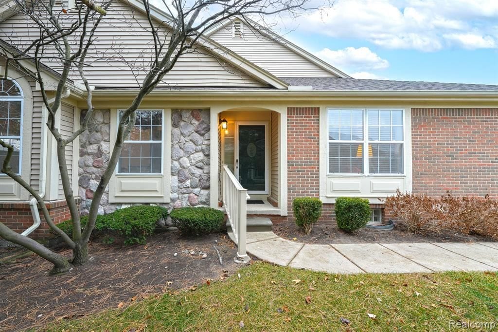 property entrance with a yard