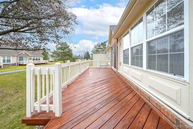 wooden deck with a yard