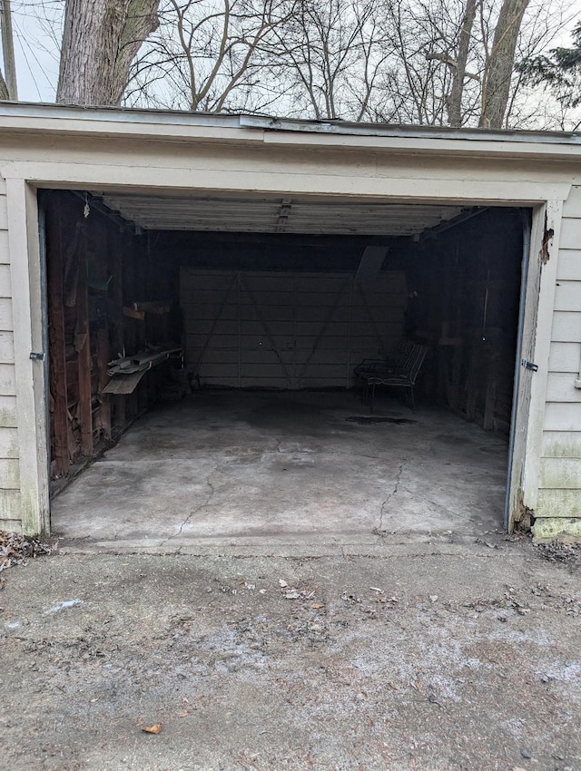 view of parking / parking lot featuring a garage