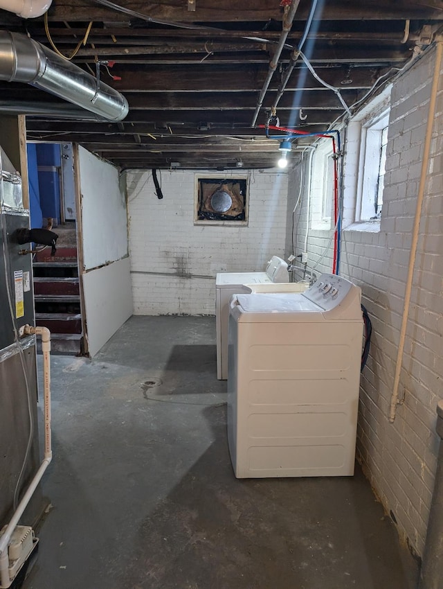 basement with washing machine and clothes dryer