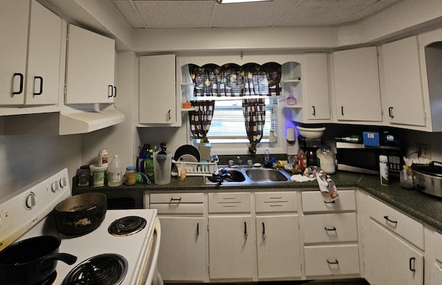 kitchen with sink, white cabinetry, a paneled ceiling, and white electric range