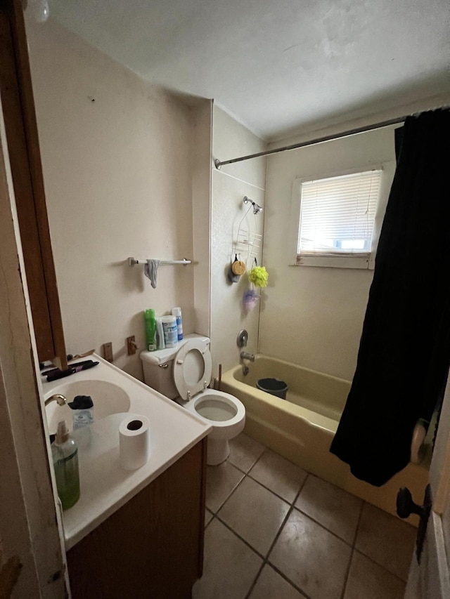 full bathroom with toilet, tile patterned flooring, sink, and shower / bath combo with shower curtain