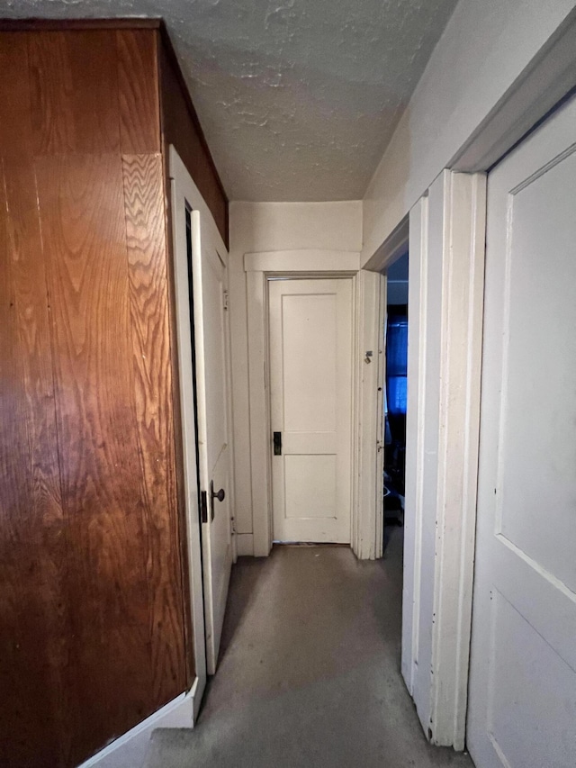 hallway featuring concrete flooring