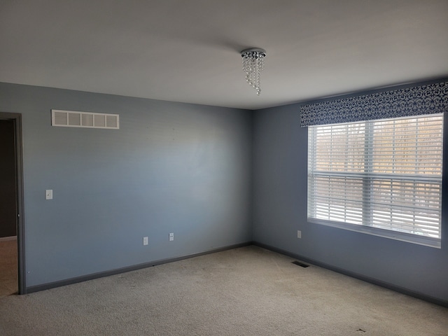 empty room featuring carpet flooring