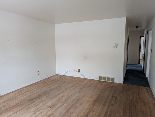 spare room with light wood-type flooring