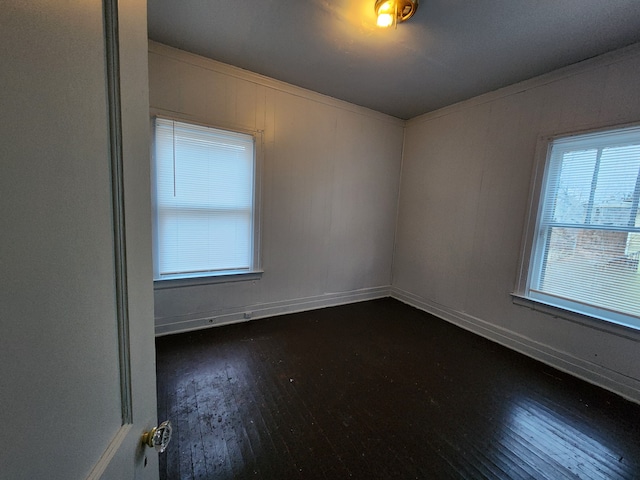 spare room featuring hardwood / wood-style floors