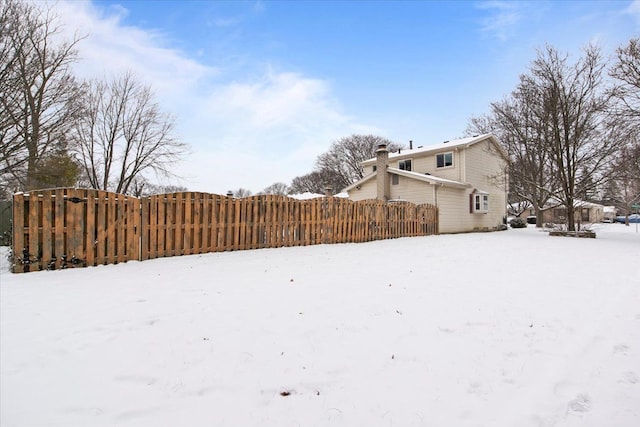 view of yard layered in snow