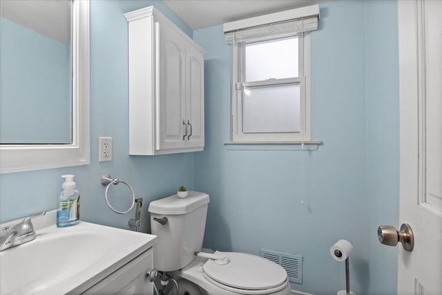 bathroom featuring toilet and sink