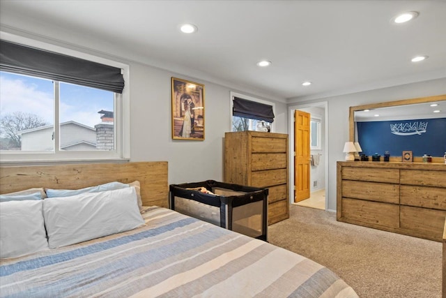 carpeted bedroom with multiple windows