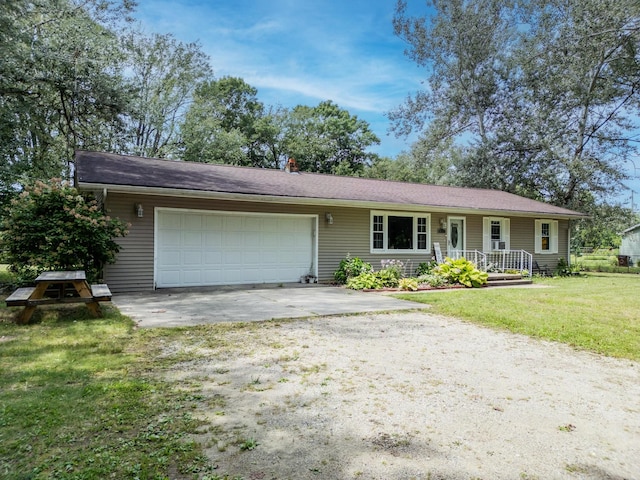 single story home with a front yard and a garage