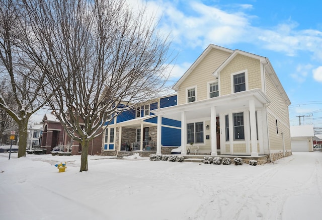 view of front of house featuring covered porch and an outdoor structure