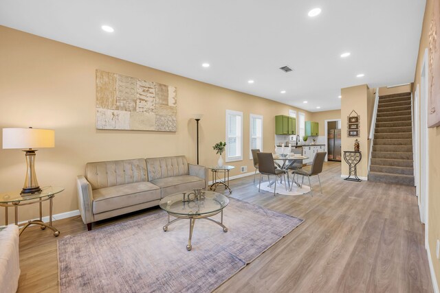 living room with light hardwood / wood-style floors