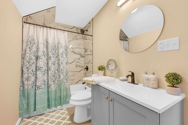 full bathroom with vanity, shower / bath combo, and toilet