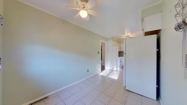 empty room with light tile patterned flooring and ceiling fan