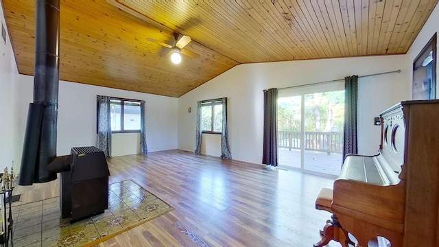 living room with lofted ceiling, hardwood / wood-style floors, wooden ceiling, and ceiling fan