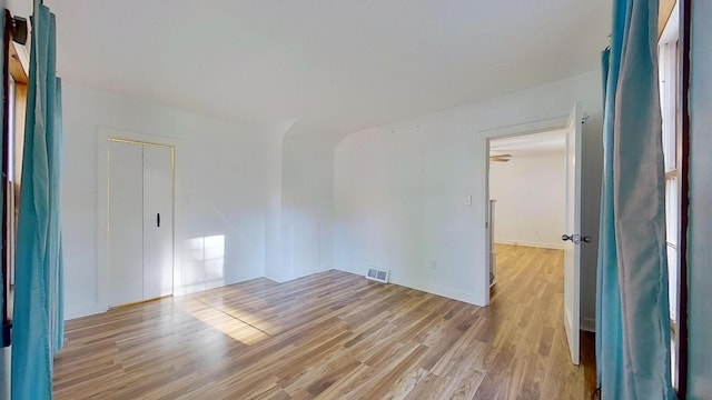 unfurnished room with light hardwood / wood-style flooring