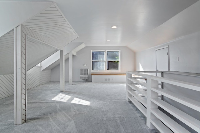 bonus room featuring light carpet and lofted ceiling