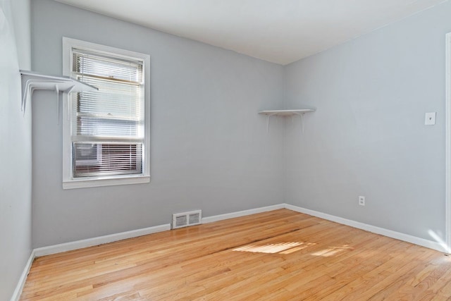 unfurnished room featuring light wood-type flooring