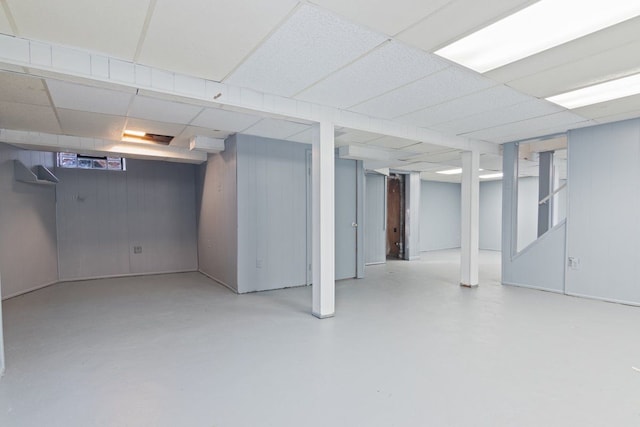 basement featuring a paneled ceiling