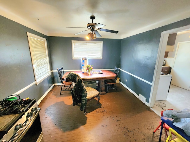 dining area with ceiling fan and wood-type flooring