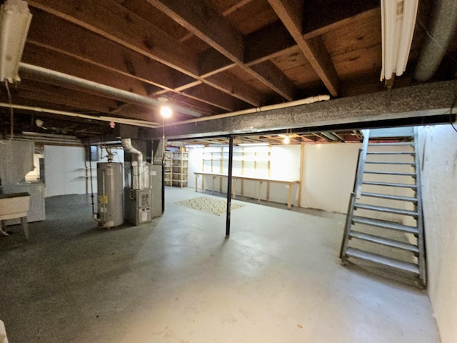 basement featuring heating unit and gas water heater