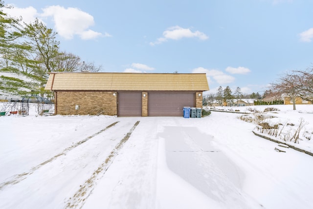 view of snow covered garage