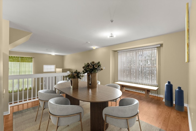 dining space featuring hardwood / wood-style floors and plenty of natural light