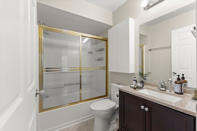 full bathroom featuring vanity, toilet, and bath / shower combo with glass door