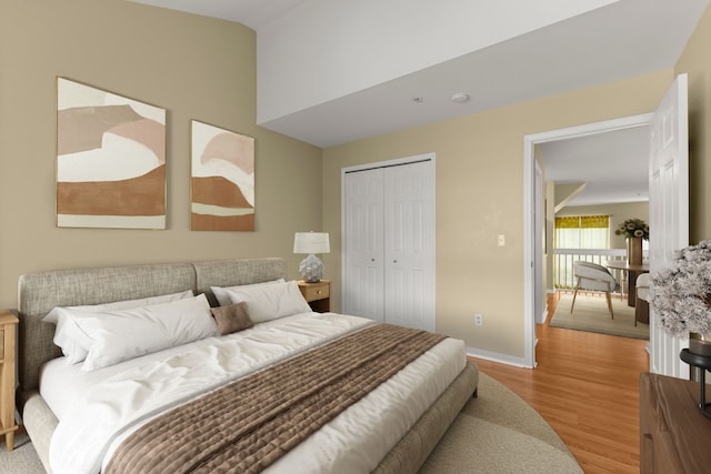 bedroom featuring light hardwood / wood-style floors and a closet