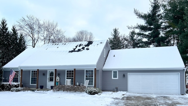 cape cod home featuring a garage and a porch