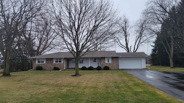 ranch-style home with a garage and a front lawn