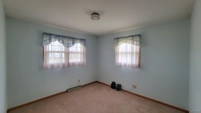 empty room featuring carpet floors