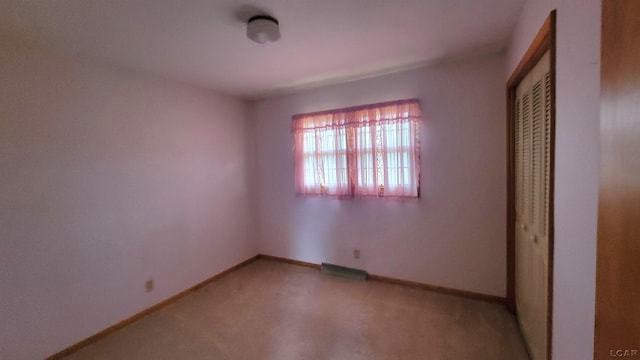 unfurnished bedroom with a closet