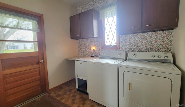 washroom with washer and clothes dryer and cabinets