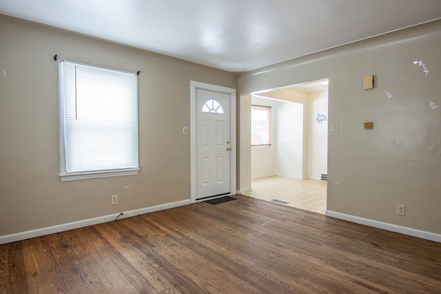 entryway with dark wood-type flooring