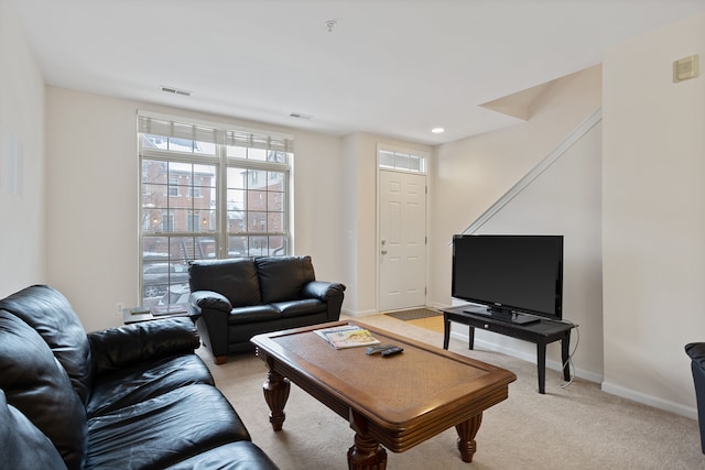 living room featuring light carpet